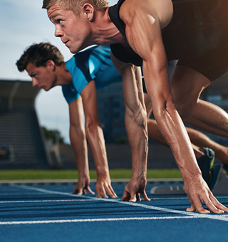 woman athlete at the starting line on a track field